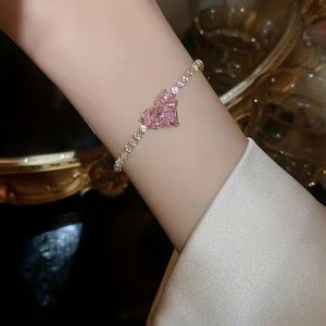 Shiny pink heart with gold bracelet